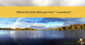 A rainbow above a lake, with a quote about mystery