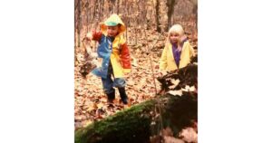 An old film photo of 2 kids hiking