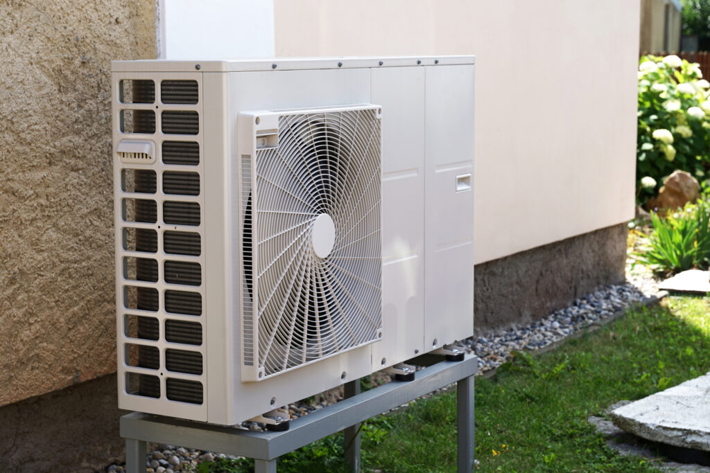 Heat pump or air conditioning outdoor unit in modern house