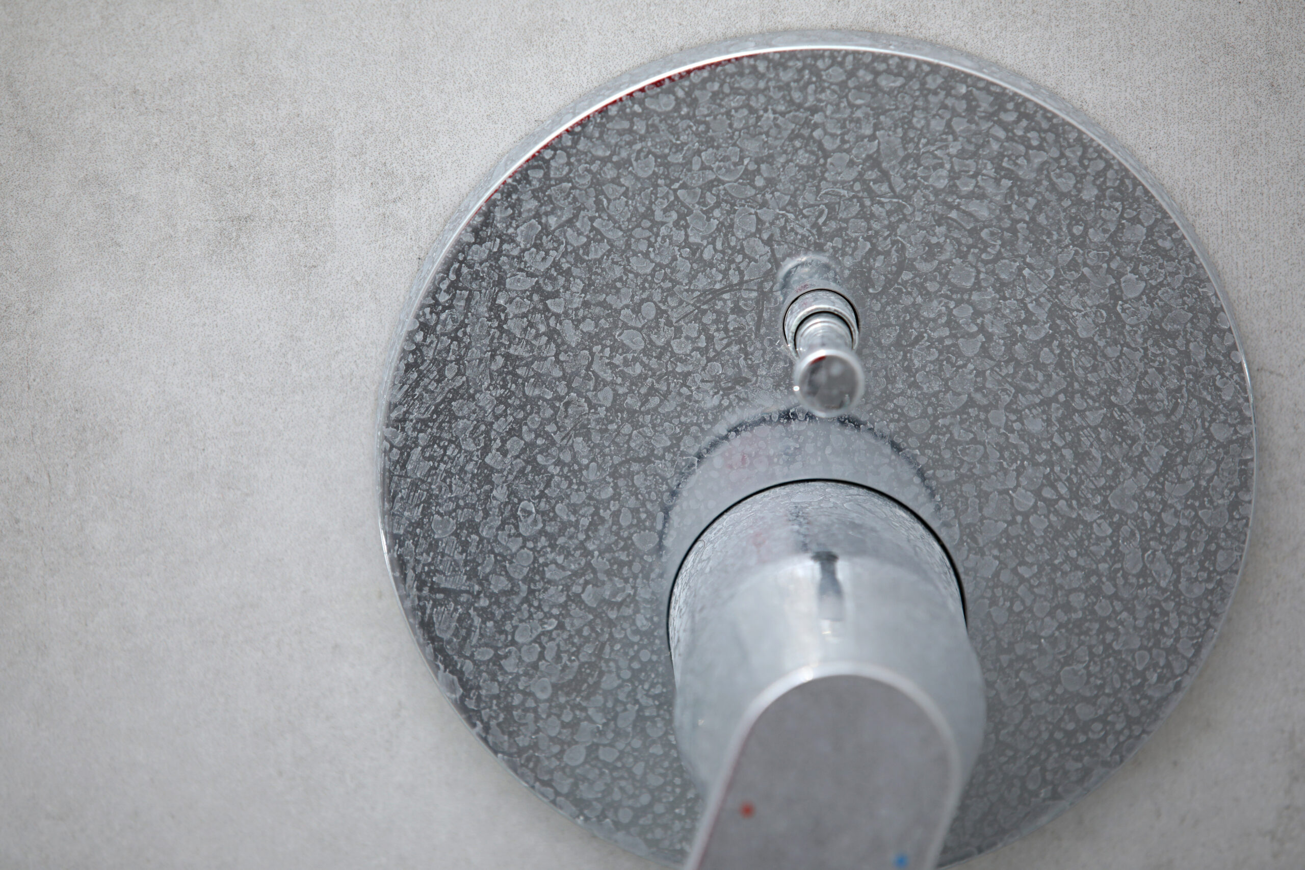 faucet with limescale & soap scum on it