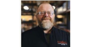 A smiling Frasier's employee in uniform