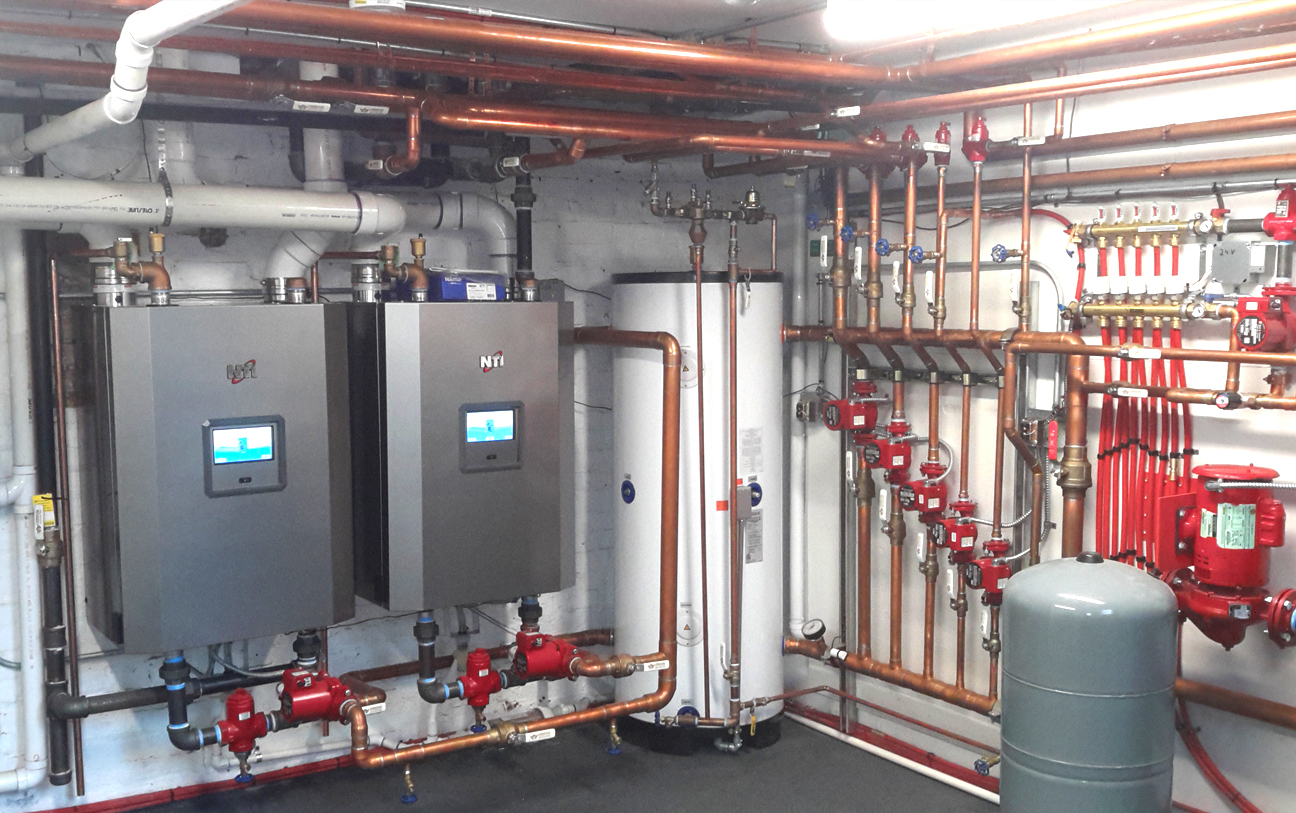 Heating equipment with organized hydronic piping