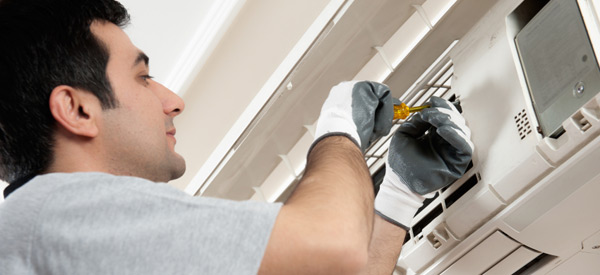 Technician repairing a home's ductless mini-split