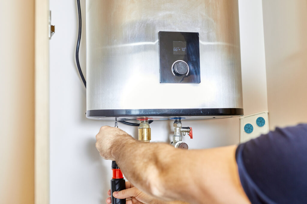 Man fixing a tankless water heater